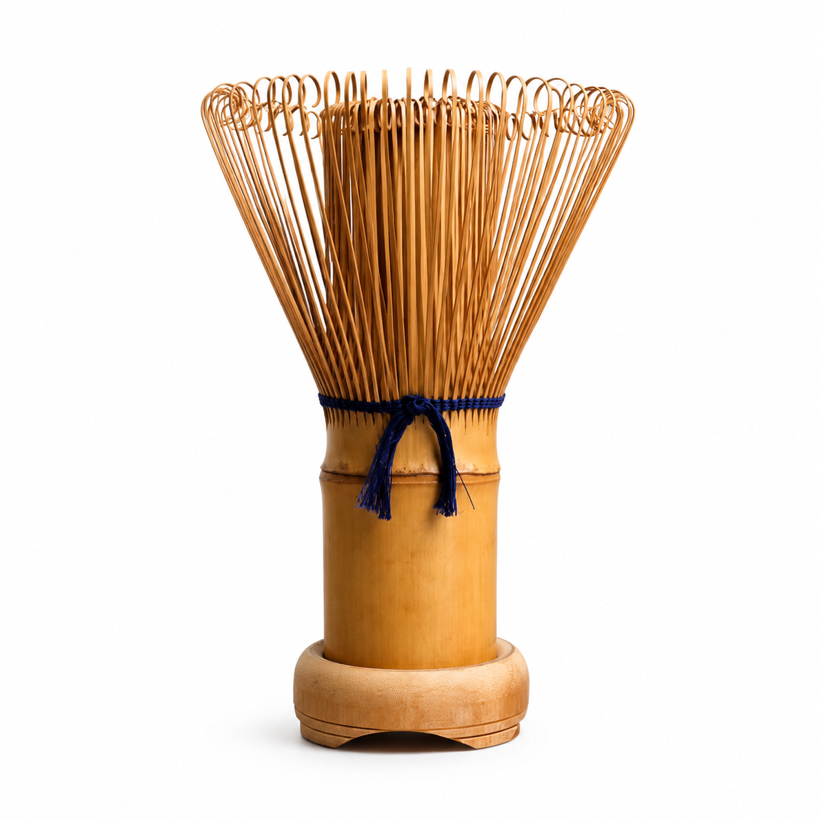 Bamboo whisk with wooden handle on a white background